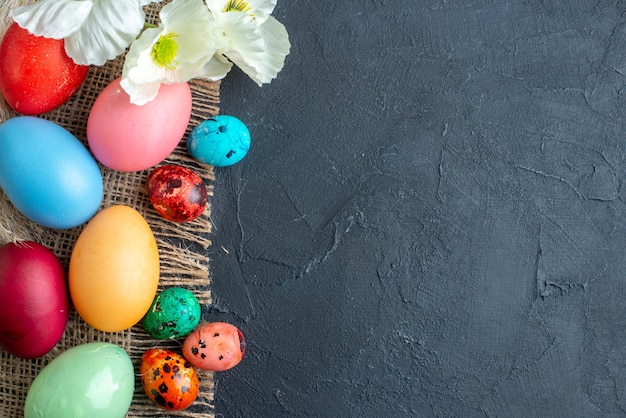 top view colored easter eggs on dark surface