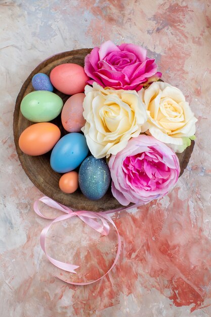 top view colored easter eggs with flowers on brown background holiday colourful ornate spring easter