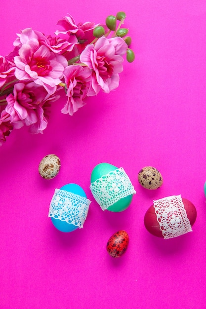 top view colored eggs on pink background colourful concept spring holiday ornate novruz