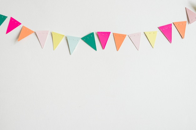 Photo top view colorful paper garland hanging