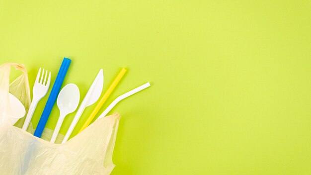 Top view colorful plastic cutlery