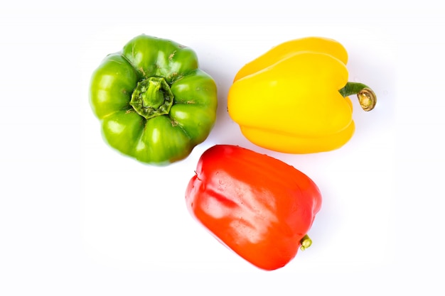 Top view colorful vegetable, yellow, green and red, bell pepper isolated on white background