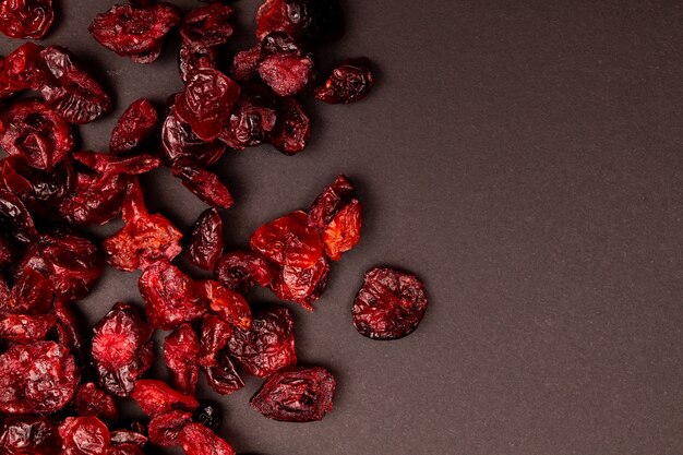 Top view composition of healthy organic dried red cranberries