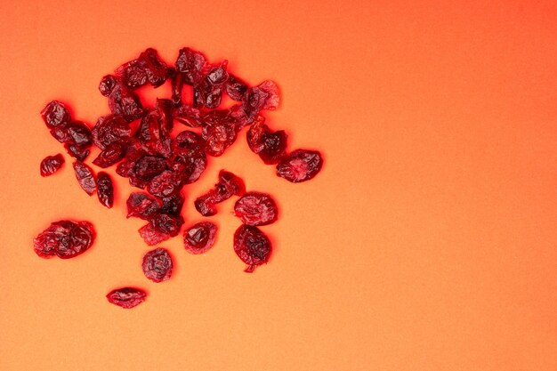 Top view composition of healthy organic dried red cranberries