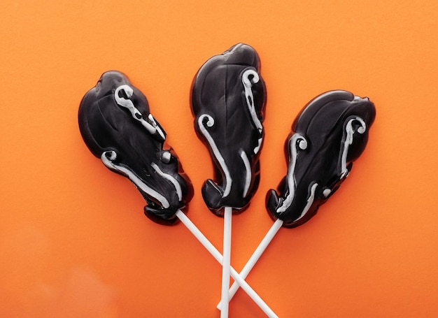 Top view of composition of various halloween cookies on black table