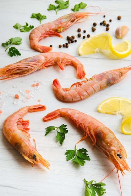 Top view of composition with fresh raw prawn with spice and herbs