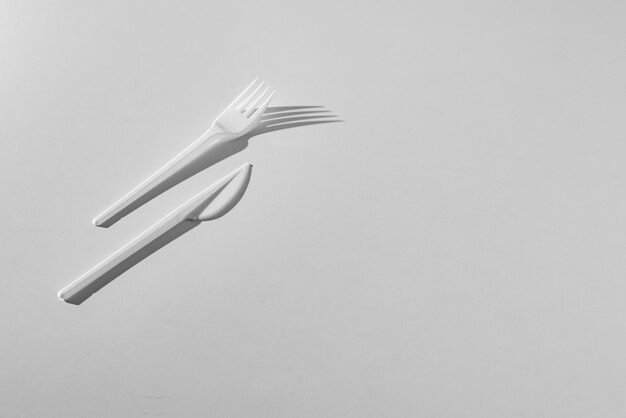 A top view conceptual minimalism with plastic table utensil tablewear cultery