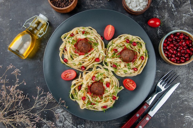 Top view cooked dough slices with meatballs on gray background pasta meat dish dinner cooking color restaurant