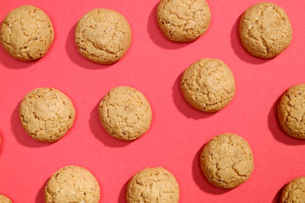 Top view of cookies biscuits on red background Flat lay Pattern