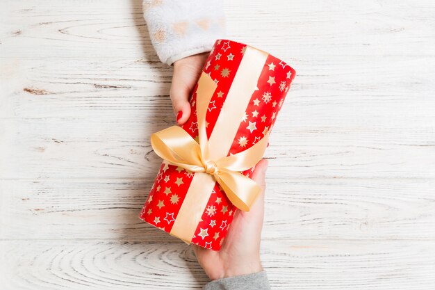 Top view of couple giving and receiving a gift