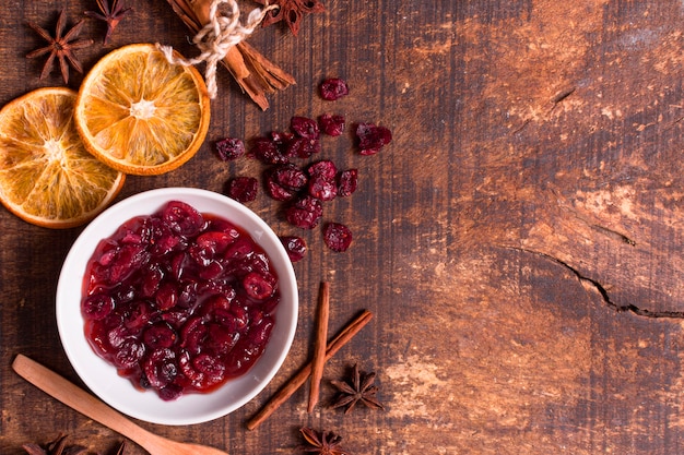 Top view of cranberry sauce with dried citrus and copy space