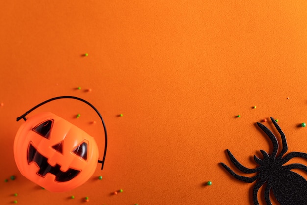 Top view of creative halloween concept decoration on orange paper table background