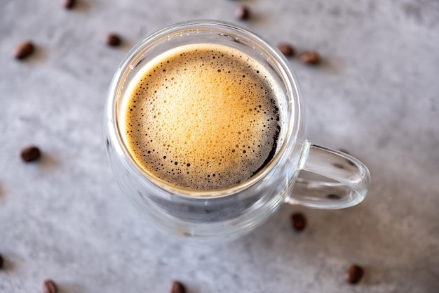 Top view for cup of coffee on grey background