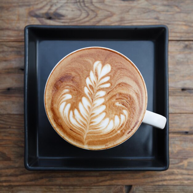 Top view cup of coffee mocha on wooden