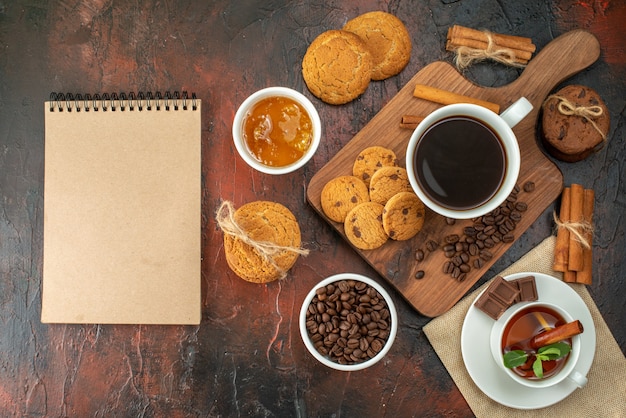 top view cup of coffee with biscuits and tea on a dark background cookie color morning breakfast sugar cocoa sweet tea