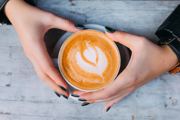 Top view on a cup of coffee with foam