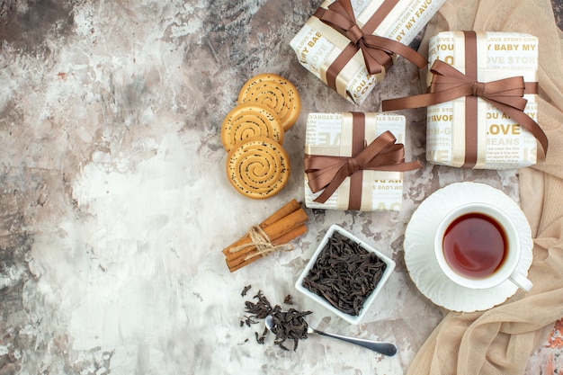 Top view cup of tea with biscuits and present on light background valentines day couple feeling love sweet marriage cookie sugar