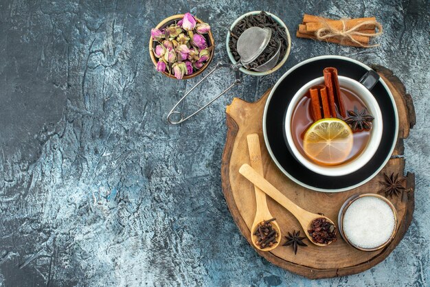 Top view cup of tea with black tea and biscuits on light gray background drink tea fruit water color breakfast photo ceremony free space