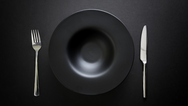 Top view of cutlery and empty plate