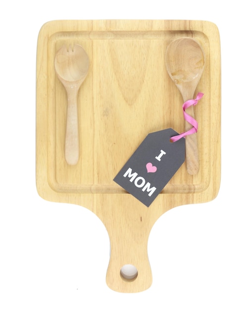 Top view of cutting board with spoon fork and i love mom card