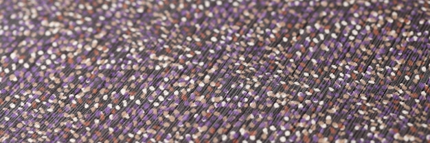 Photo top view of dark fabric with colourful spots texture background cloth with spots seamless