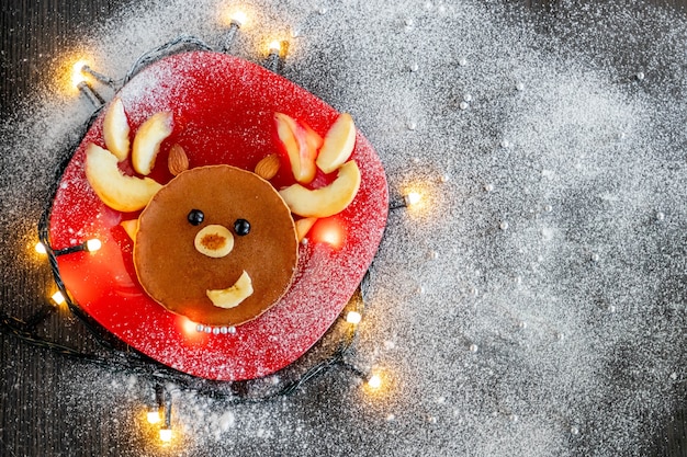 Top view of deer shaped pancake on a plate
