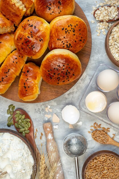 top view delicious buns with pastries cereals and eggs on white background dough pie fruit cook cake color pastry bake