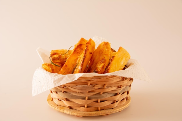 Top view Delicious Fried Cassava in Handcrafted wooden Bowl on white Studio Background