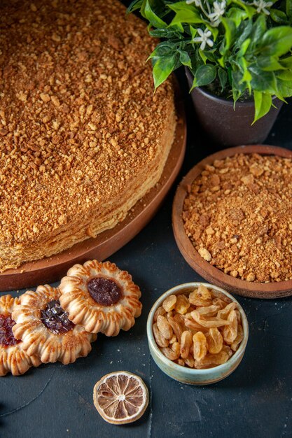 Top view delicious honey cake on the dark surface