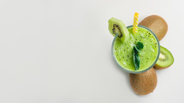 Top view of delicious kiwi detox drink isolated on a white surface