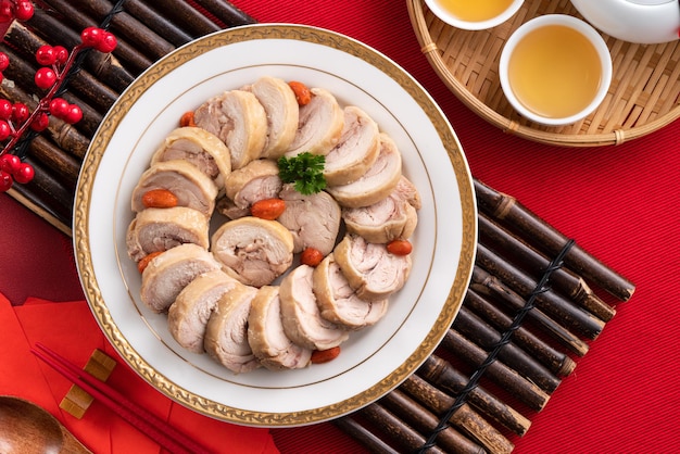 Top view of delicious sliced chicken roll soaked in Chinese wine named drunken shrimp for lunar new year's dishes.