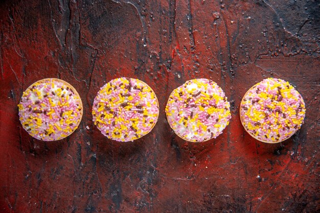 top view delicious sweet biscuits on dark red background sweet horizontal cake pie biscuit sugar tea