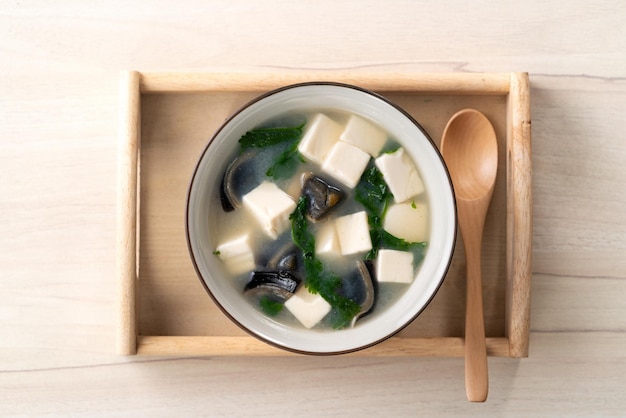 Top view of delicious tofu and century egg soup with coriander in Taiwan