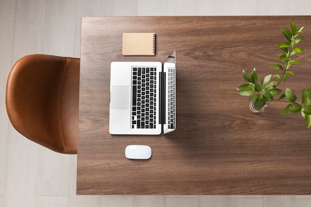 Top view desk arrangement with laptop