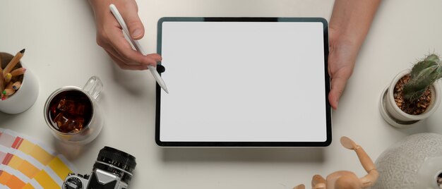 Top view of the desk with a digital tablet