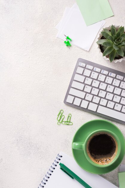 Photo top view of desk with keyboard and stationery