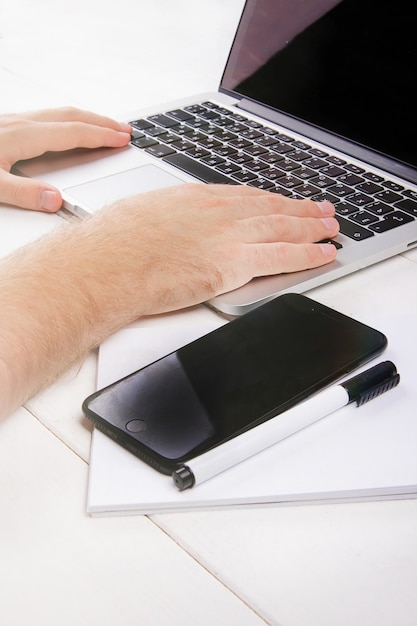 Top view of the desktop and mens hands