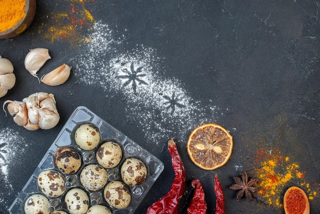 Top view different ingredients flour eggs milk and seasonings on a dark surface