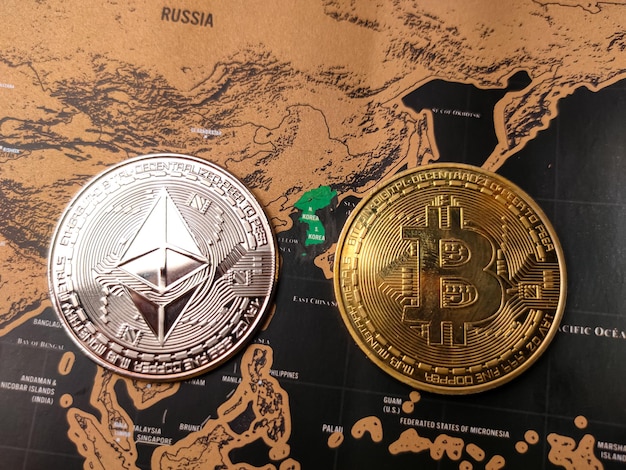 Top view digital currency silver eth and golden btc on a korean\
map background