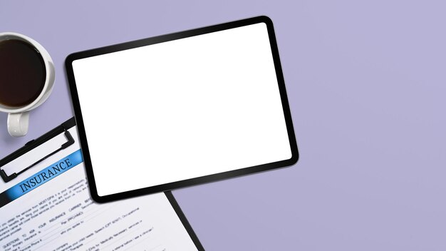 Top view digital tablet and insurance claim form on purple background Blank screen for advertise text