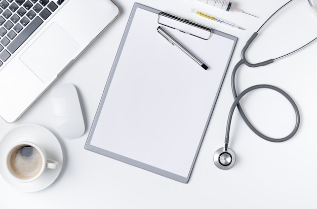 Top view of doctor desk table with stethoscope