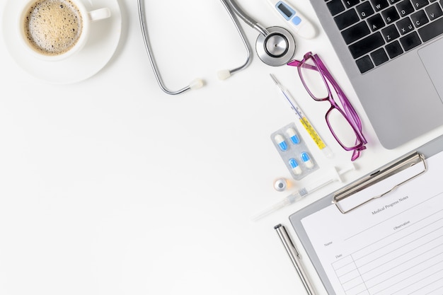 Top view of doctor desk table with stethoscope