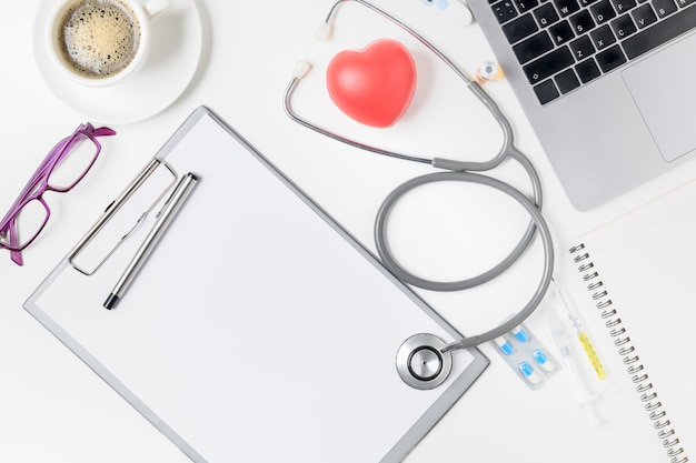 Top view of doctor desk table with stethoscope