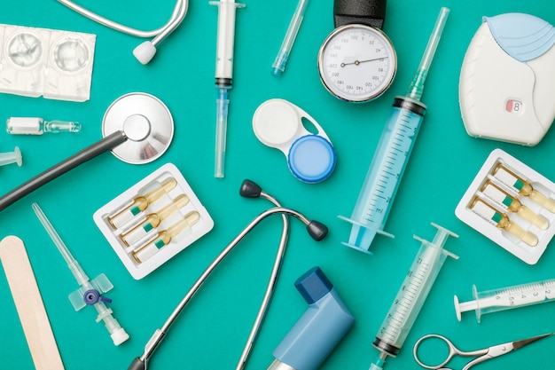 Photo top view of doctor's table with stethoscope and other equipment