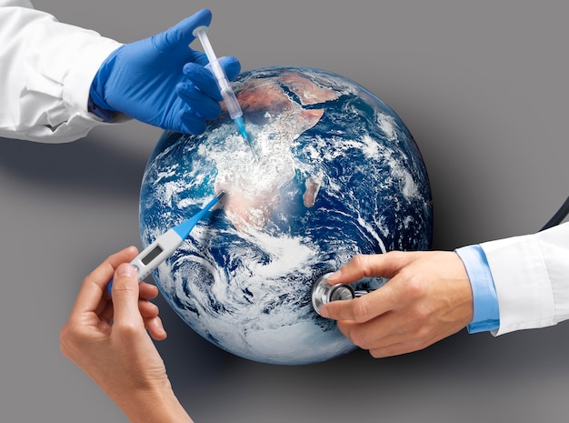 Photo top view doctors vaccinating the earth