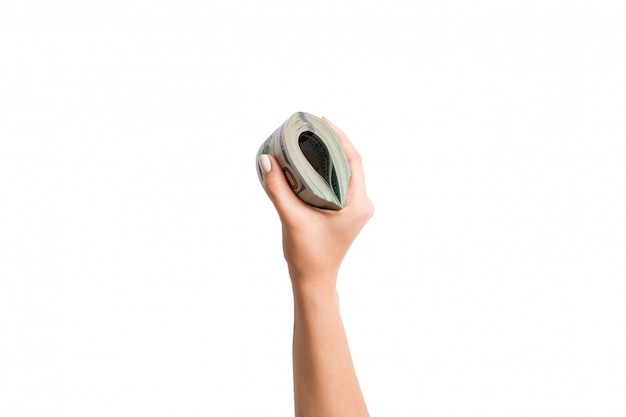 Top view of dollar banknotes in female hand on white isolated background