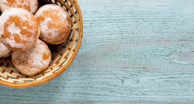 Top view of donuts in basket with copy space