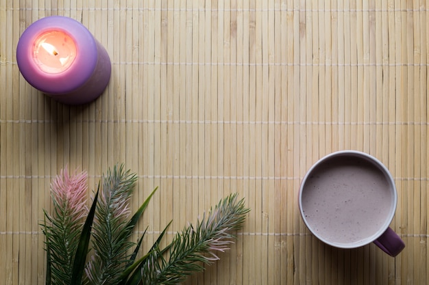 Top view on drink in a cup on bamboo background