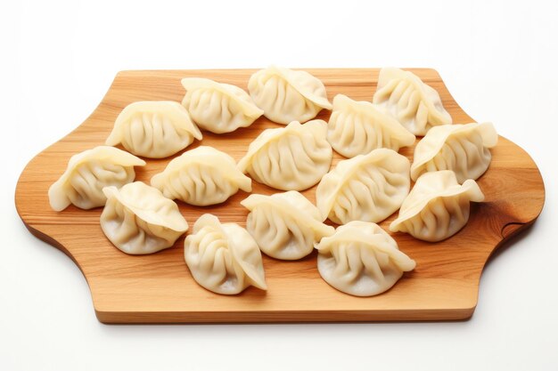 Top View Dumplings On A Wooden Boardon White Background