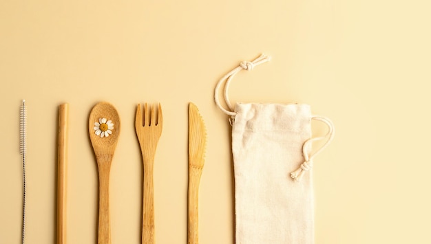 Top view of eco friendly cutlery set on the pastel background.Zero waste dinnerware.Large banner,negative space for text or design.